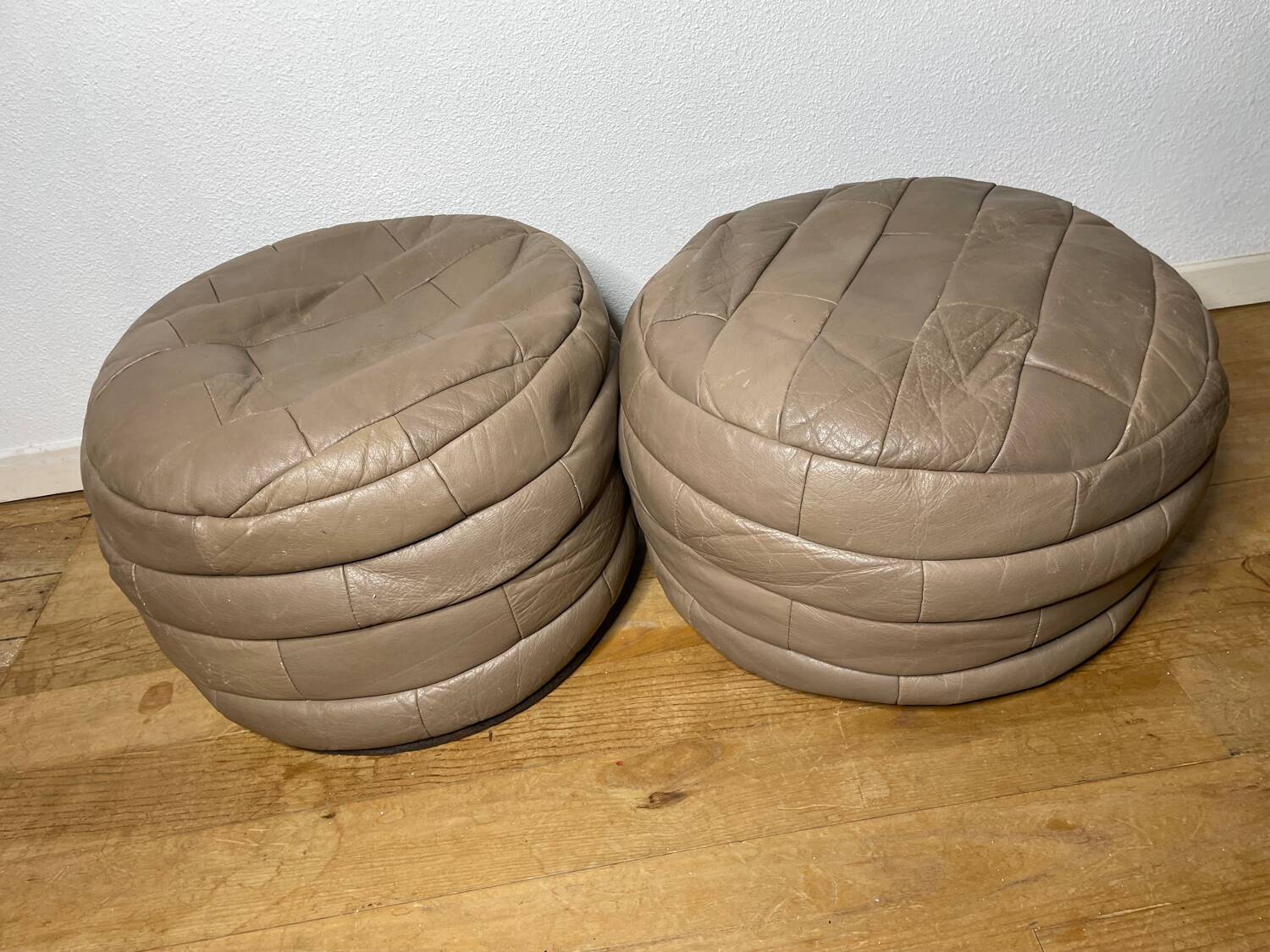 Pair of De Sède patchwork leather poufs