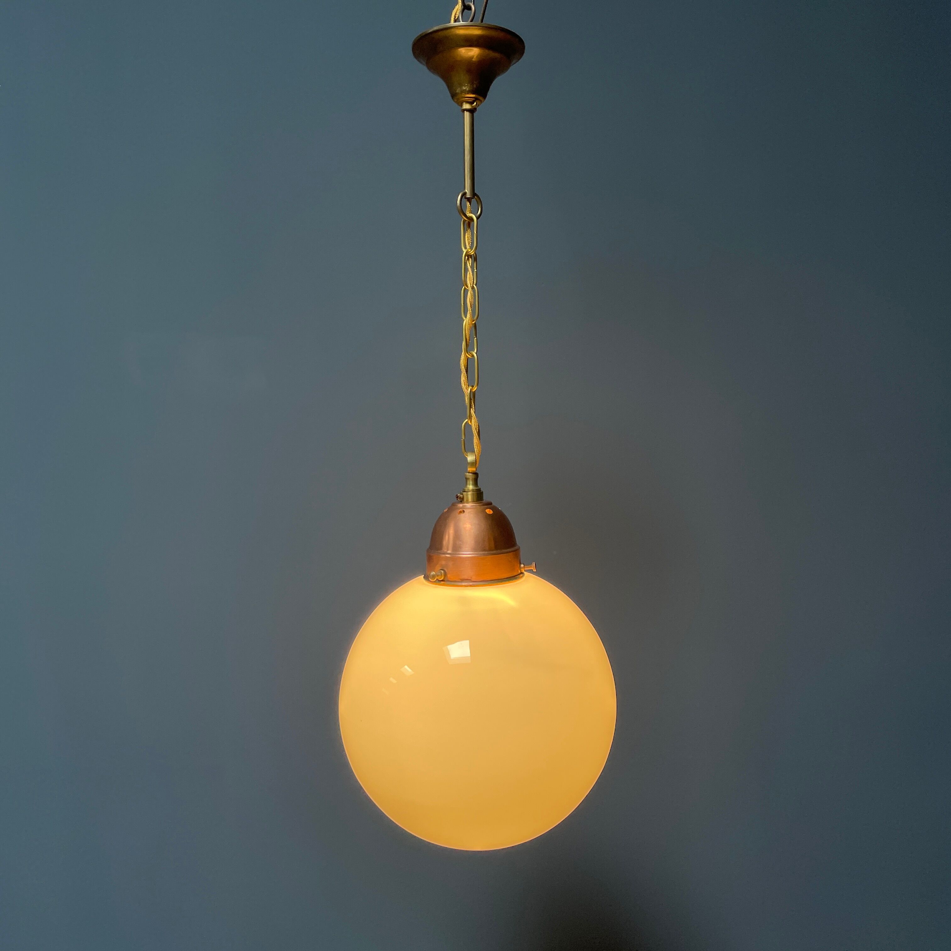 Opaline glass ball hanging lamp with copper fixture