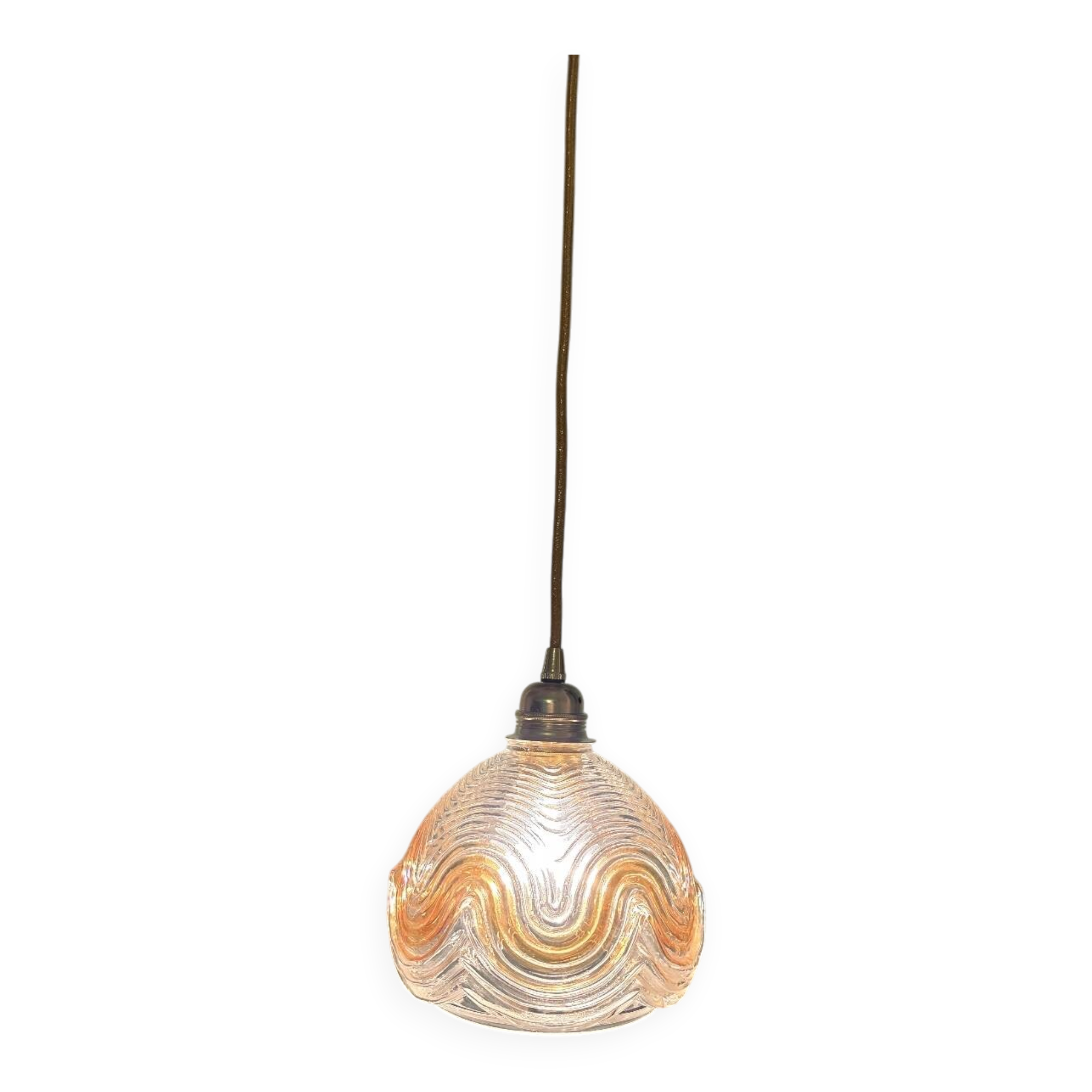 Suspension with amber moulded glass globe featuring wavy patterns.