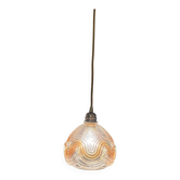 Suspension with amber moulded glass globe featuring wavy patterns.