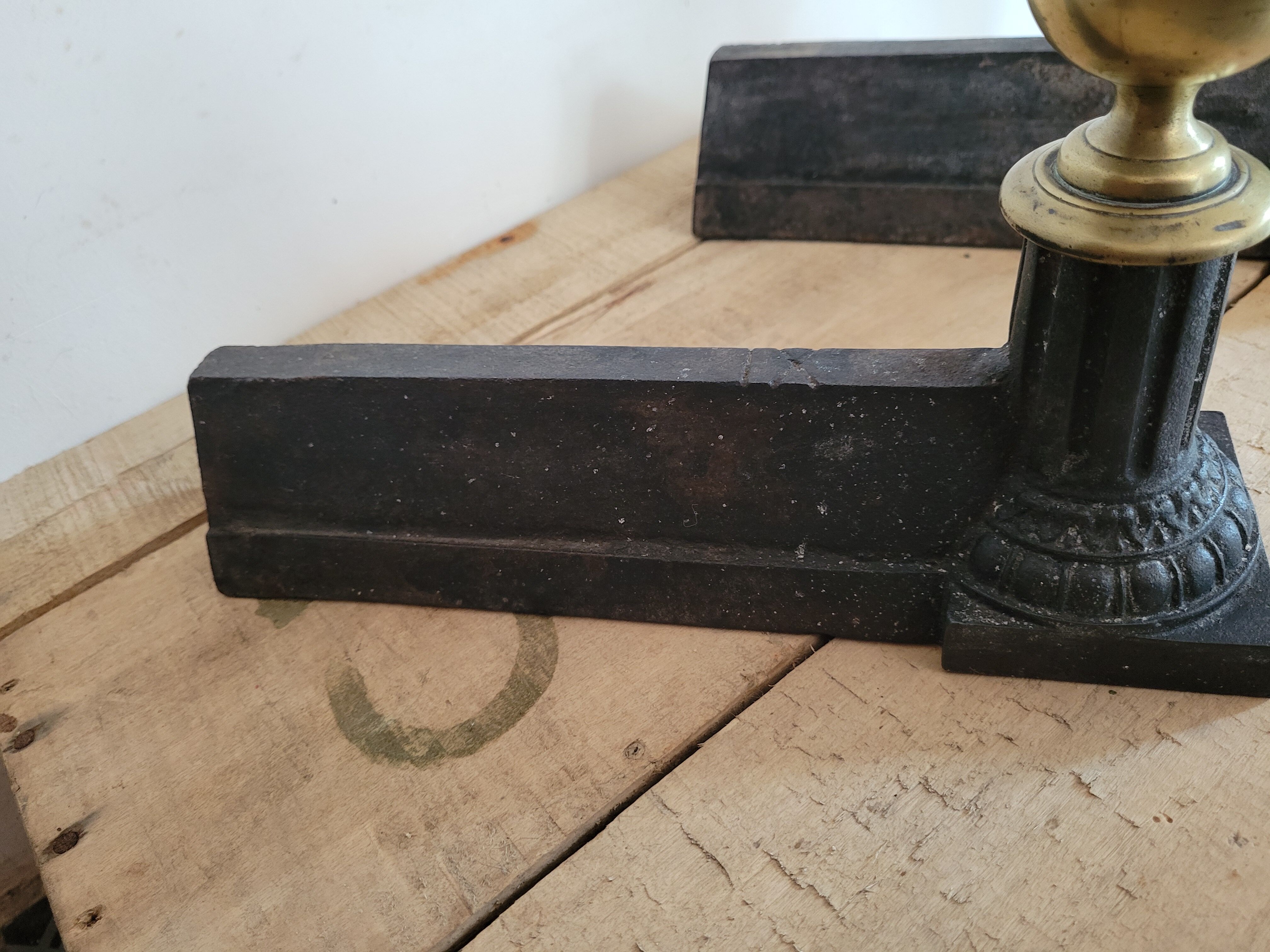 Pair of cast iron and brass chenets