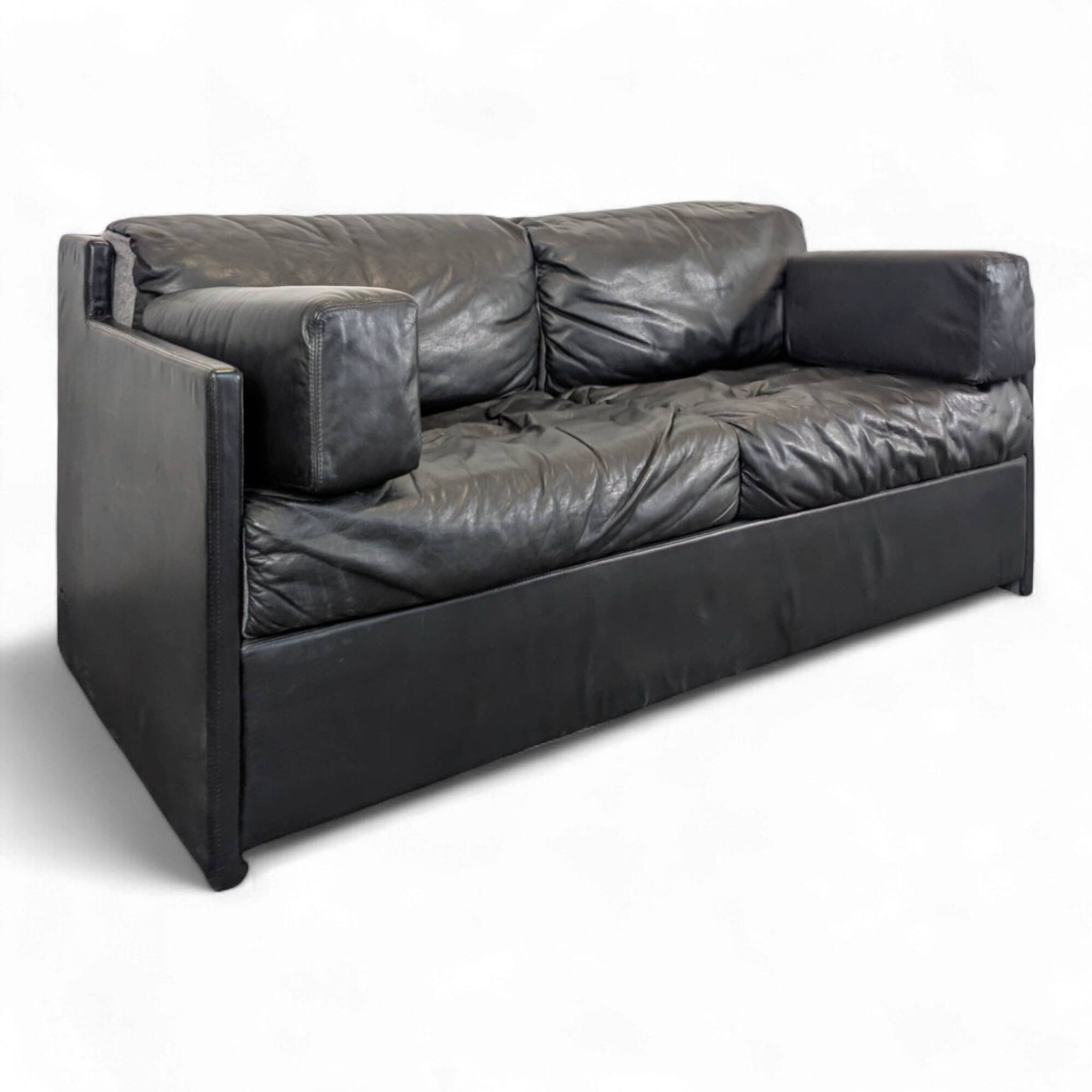 Black leather convertible sofa with goose feather upholstery.