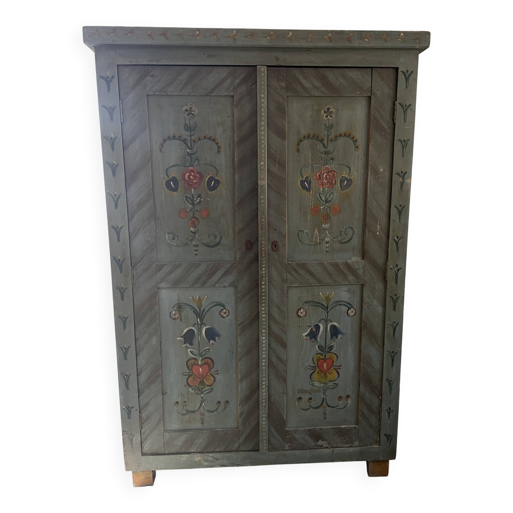 Wedding wardrobe painted in folk art style.