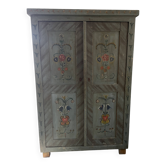 Bride's wardrobe painted in folk art style.