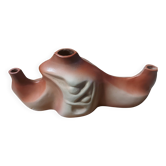 Decorative ceramic vase with organic shapes in Art Nouveau style.