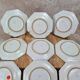 Set of 12 small antique plates by Alfred Renoleau, different designs.