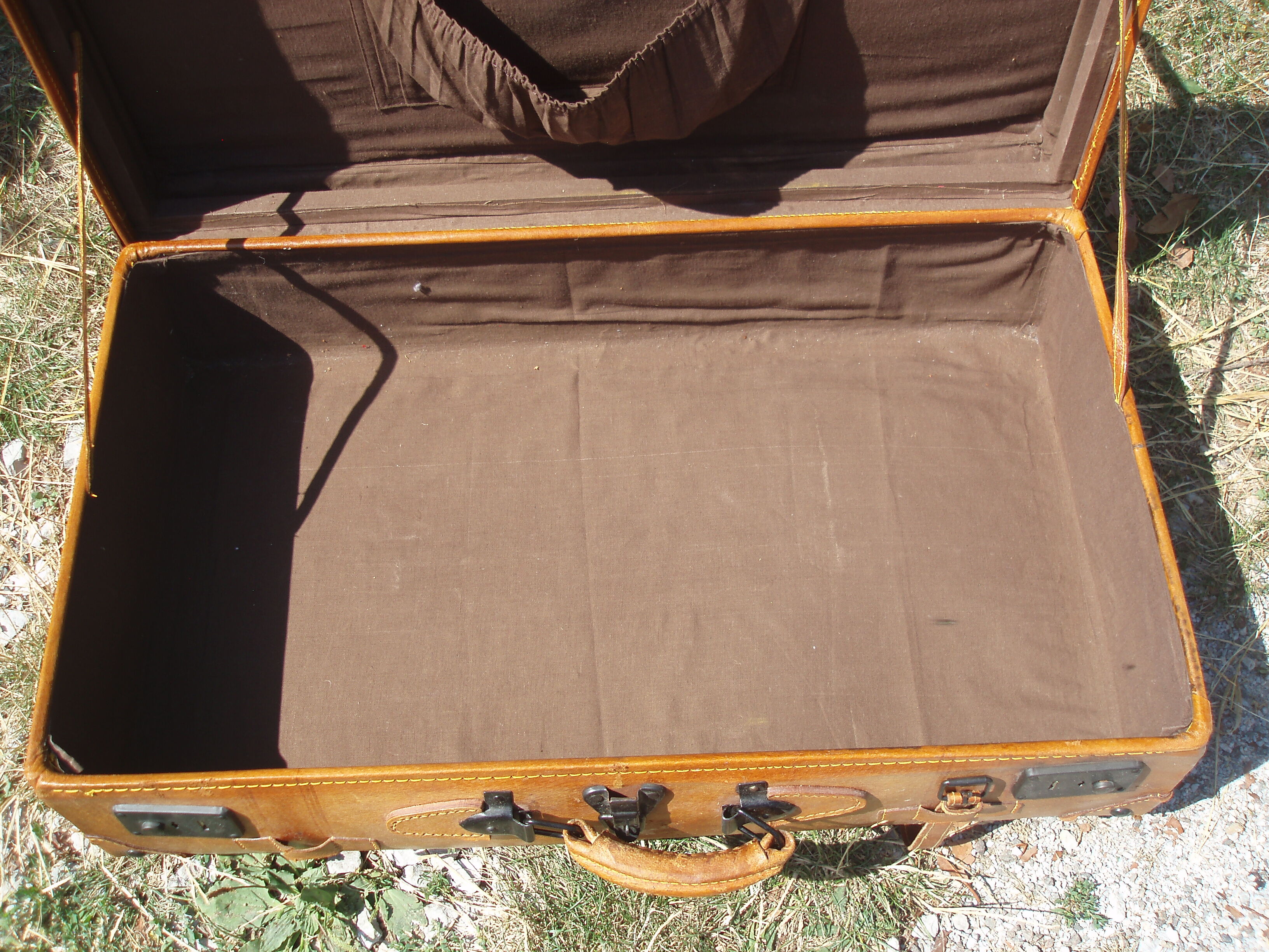 Old quality brown leather suitcase from the 60s