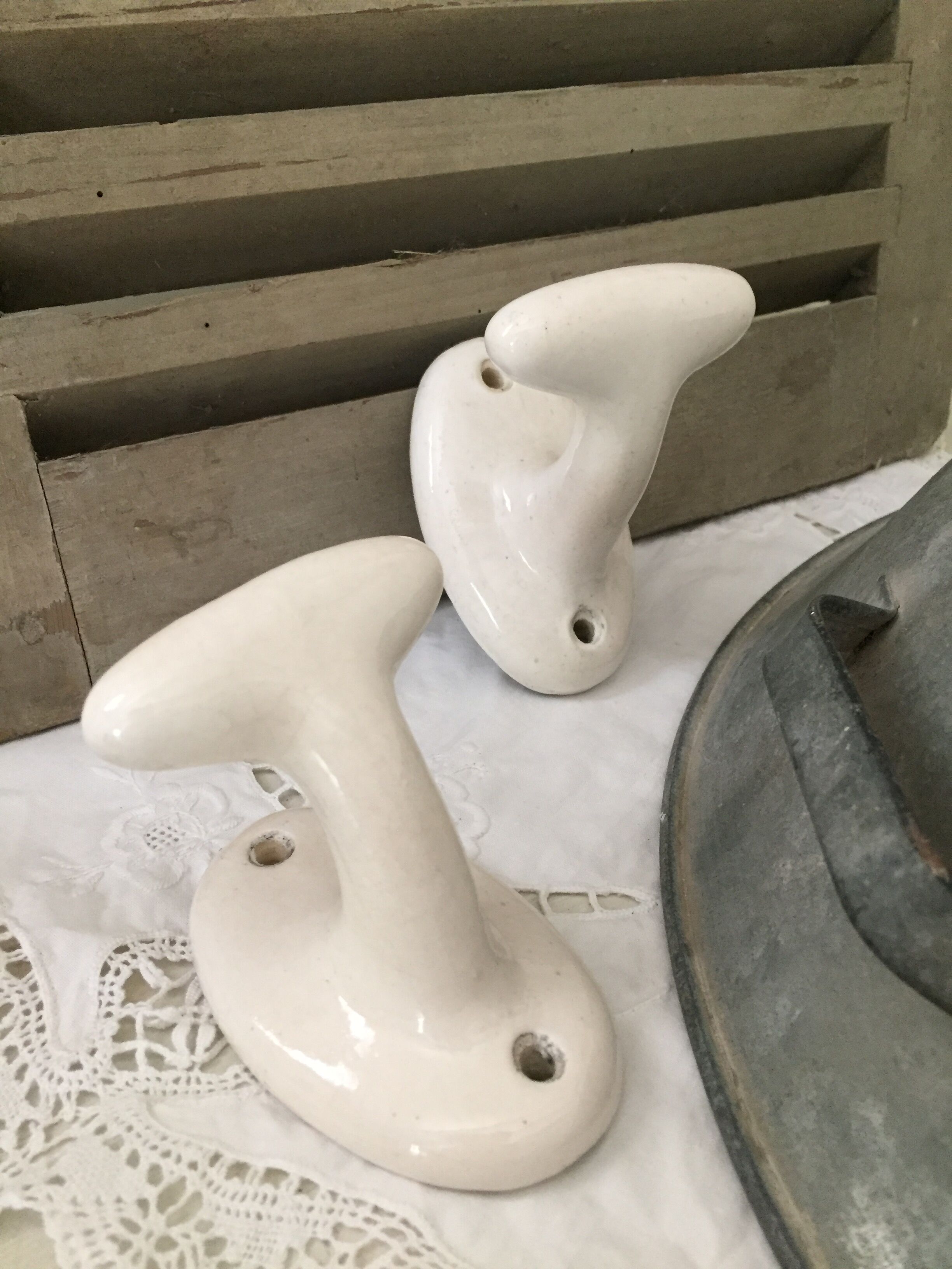 Pair of porcelain hooks
