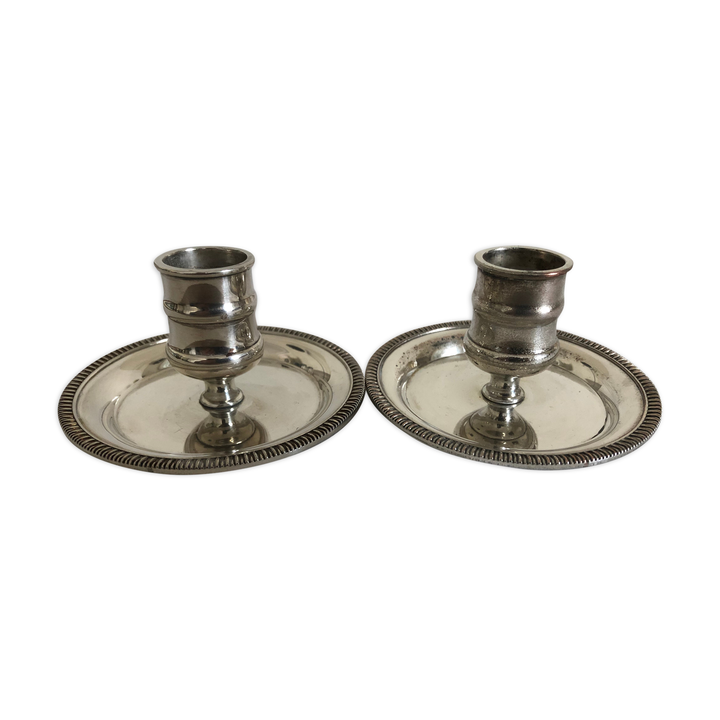 Two silver metal candlesticks