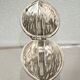 Nutcracker in the shape of a nut in silver-plated metal.