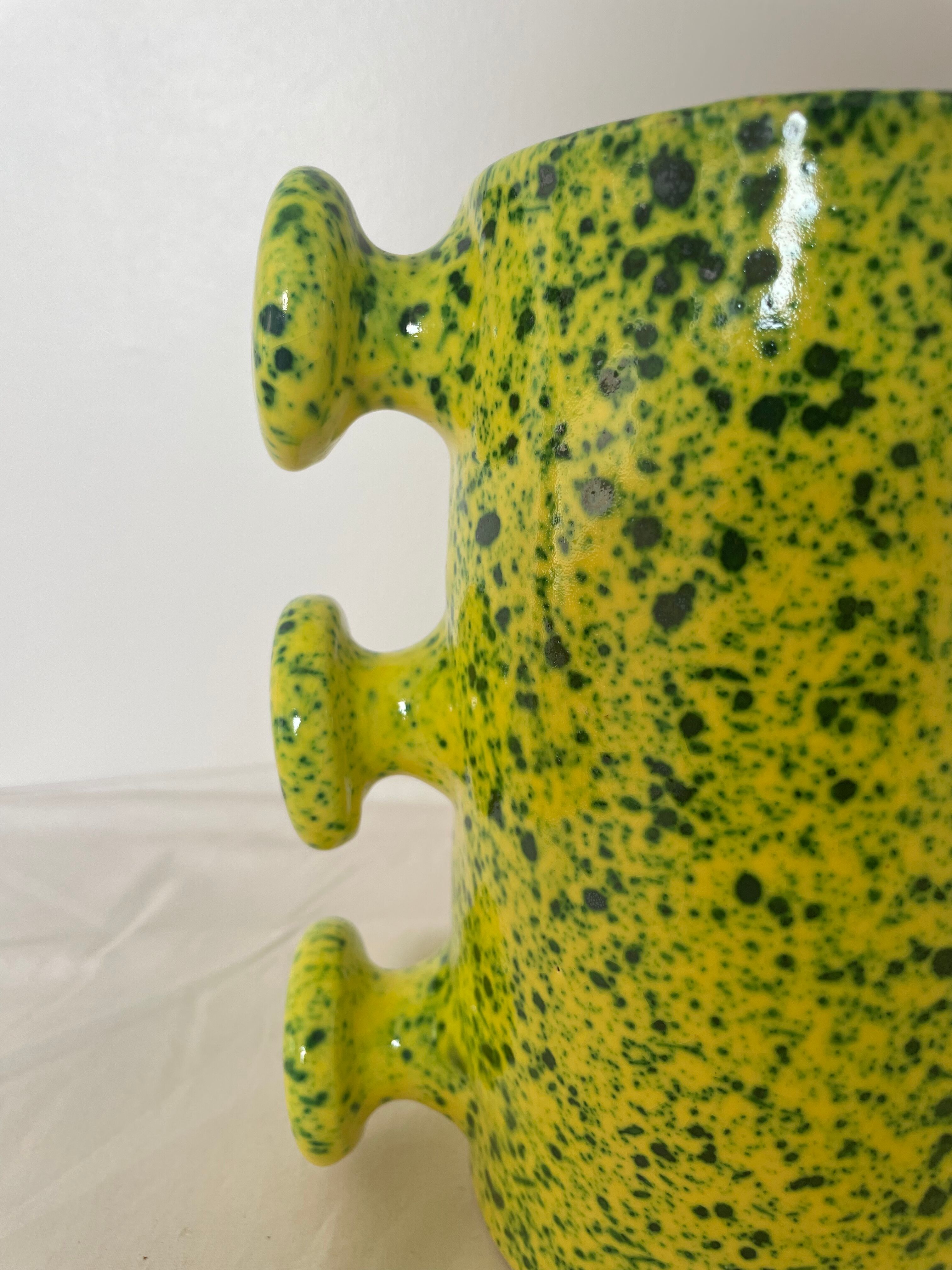 Handmade green speckled yellow ceramic vase with abstract handles