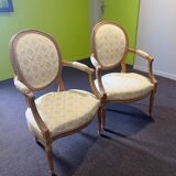 Pair of Louis XVI style armchairs, in solid walnut, re-edged and upholstered, pegged