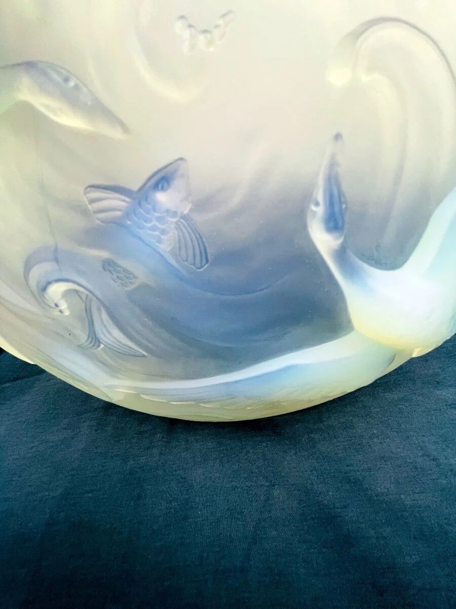 Verlys, iridescent glass cut with a design of geese and fish.