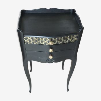 Bedside or nightstand painted black with patterns