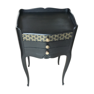 Bedside or nightstand painted black with patterns