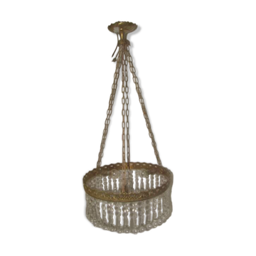 circular chandelier with a brass frame and crystal drops