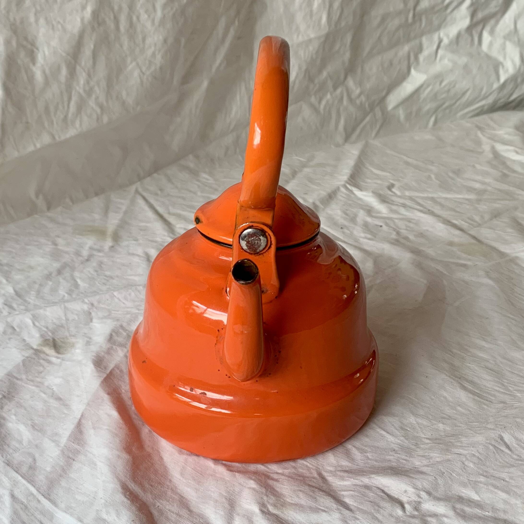 Vintage orange enameled sheet metal kettle