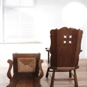 Pair of brutalist oak lounge chairs with rush seats, circa 1935