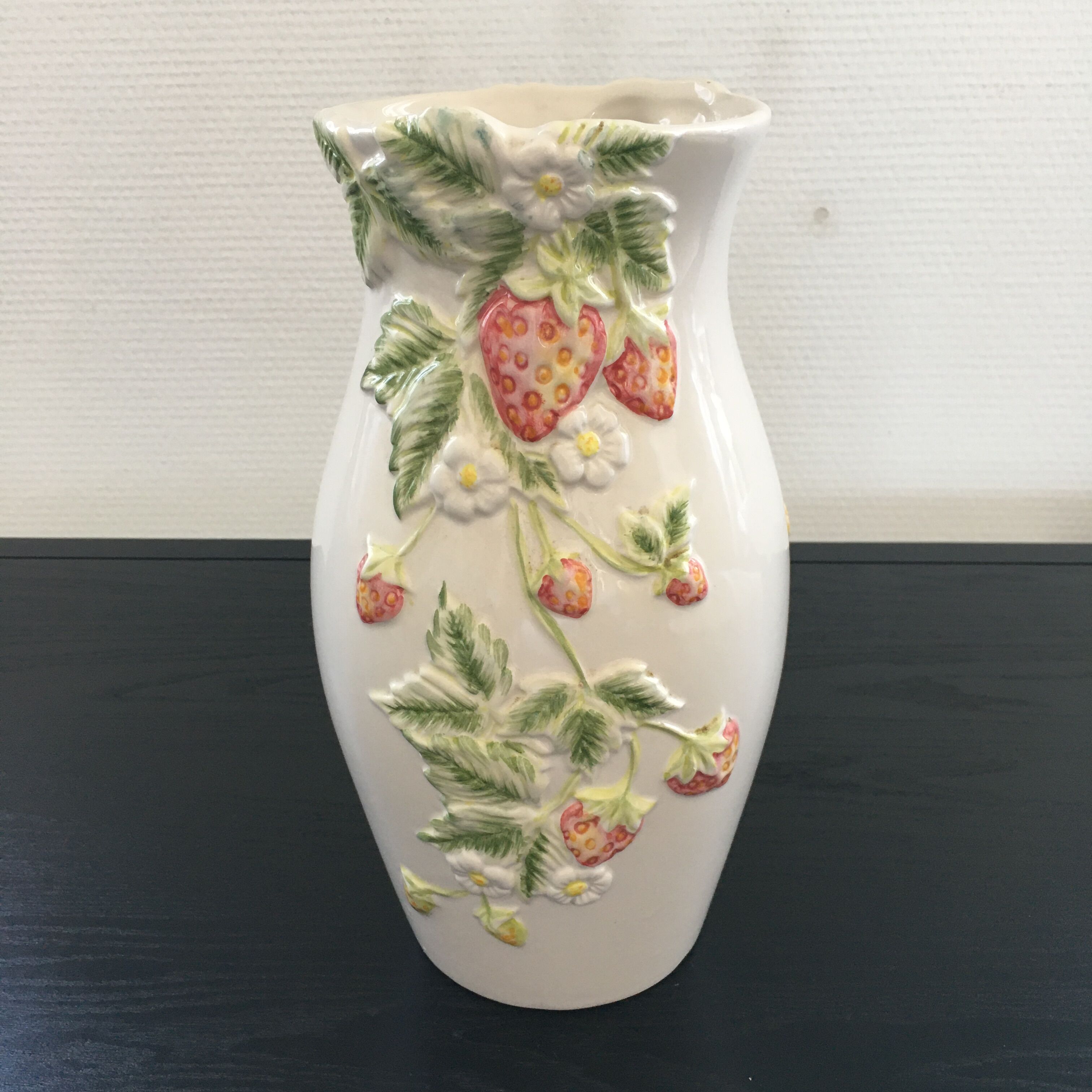 Vase decorated with strawberries in slip
