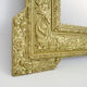Old wall mirror in wood and gilded stucco, Louis XVI style. XIXth