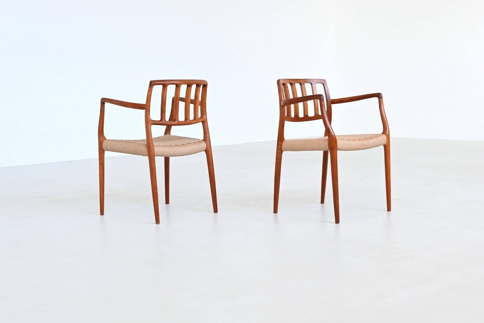 Niels Otto Moller model 66 armchairs teak and paper cord Denmark 1974