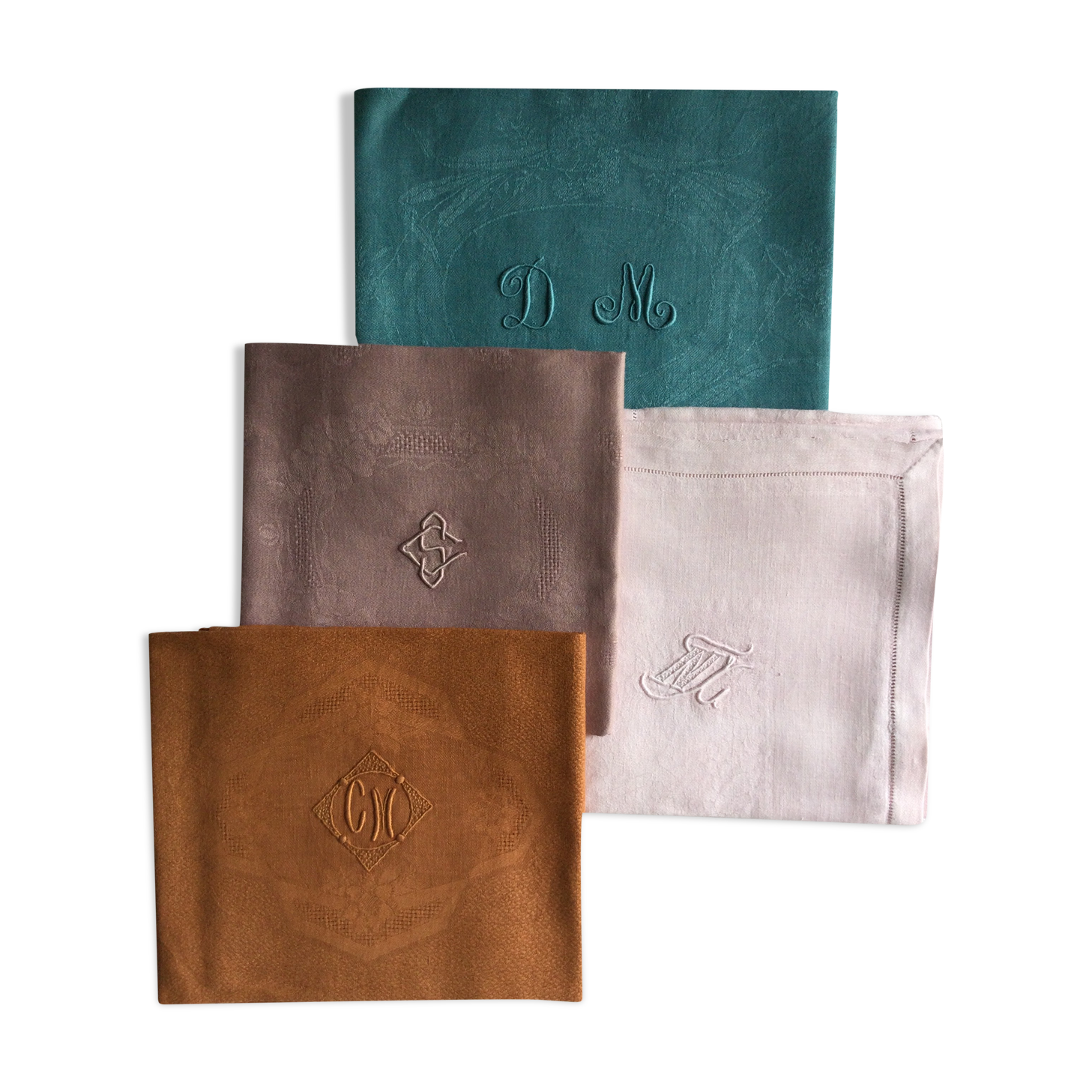 Set of four old damask towels tinted in multiple colors