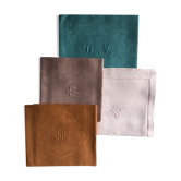 Set of four old damask towels tinted in multiple colors