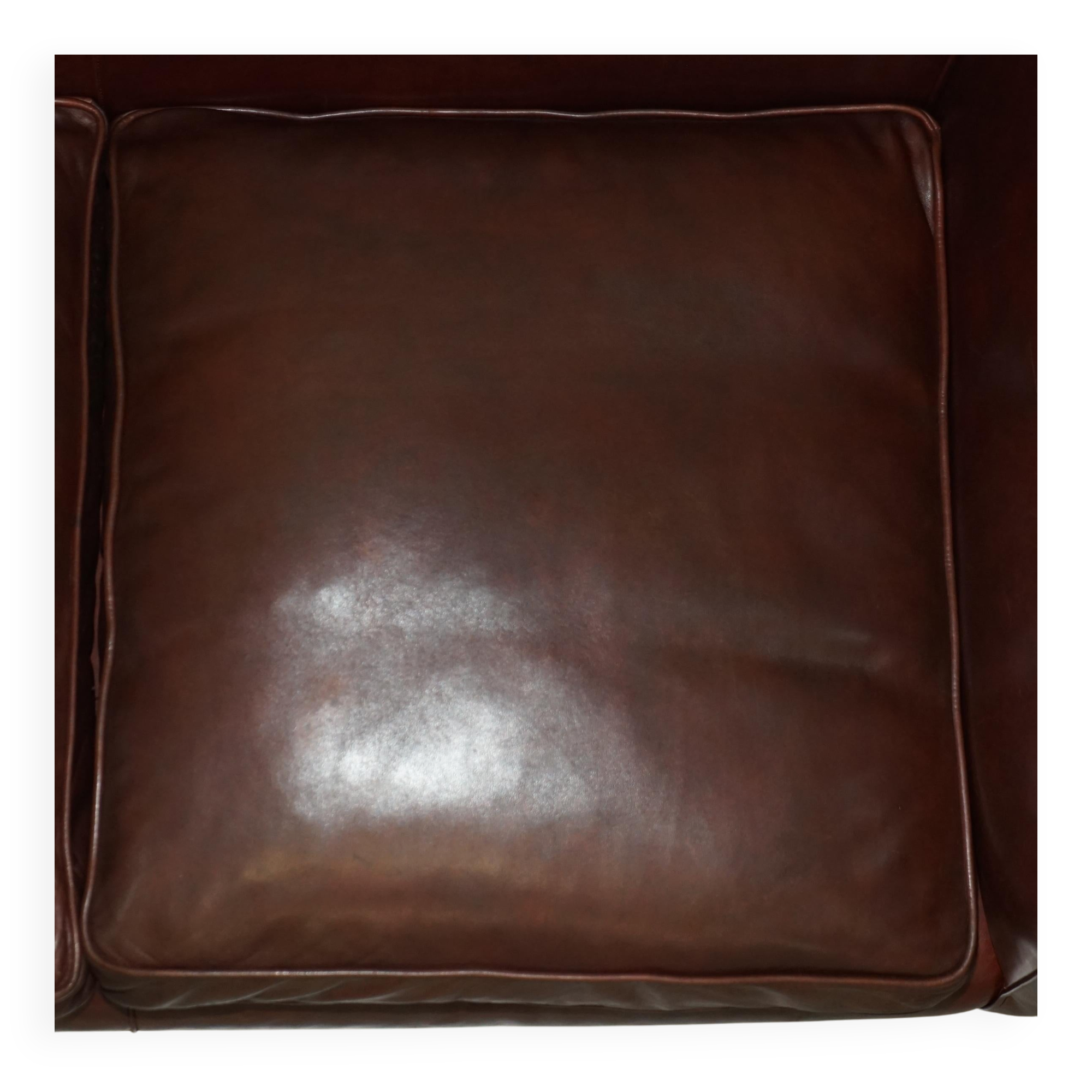 Vintage Art Deco leather sofa, three-seater, feather cushions.