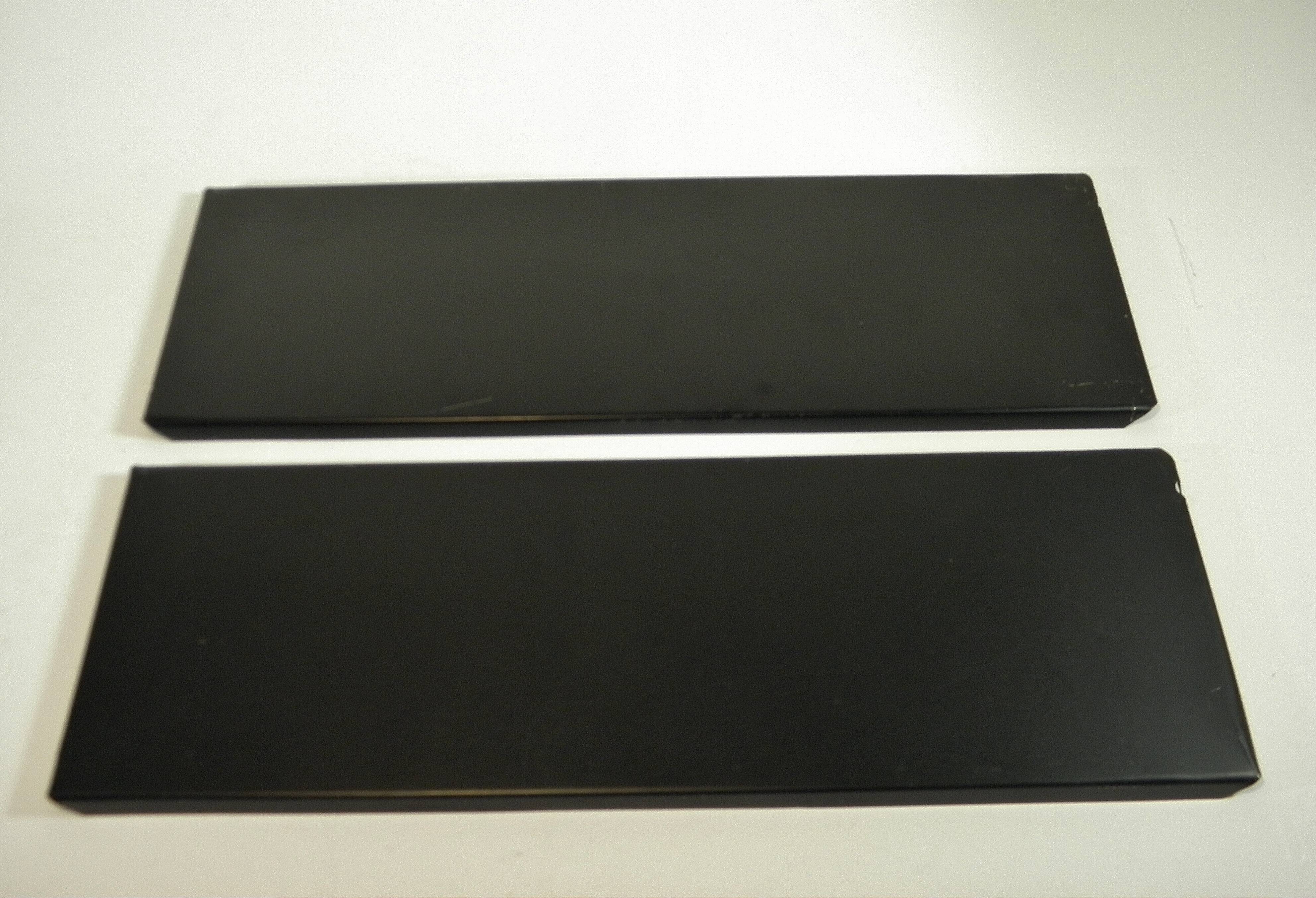 Black and gold metal wall shelf from the 1960s