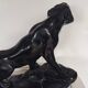 Large animal sculpture representing a roaring panther, signed BE.