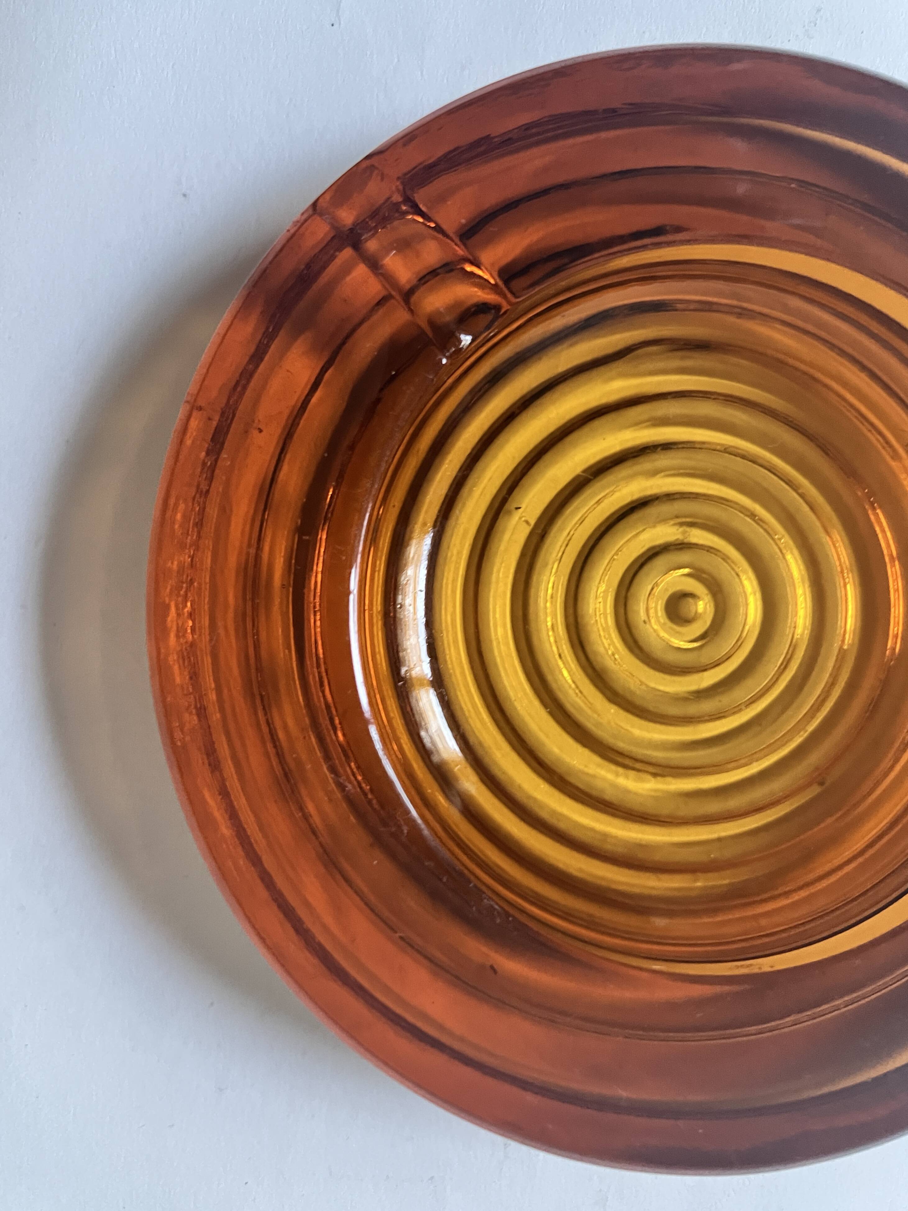 Amber pressed glass ashtray, 1970s design.