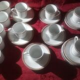Cups and saucers in fine porcelain with gilded edging