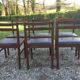 6 chaises vintage scandinave en teck , assises skaï noir en l’état