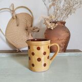 Old pitcher or polka dot vase