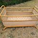 Rattan cradle.