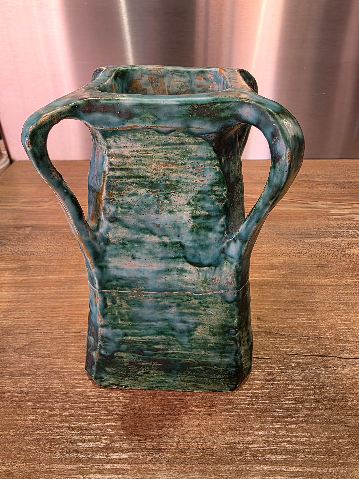 Vintage brutalist ceramic vase with 4 green handles.