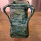 Vintage brutalist ceramic vase with 4 green handles.
