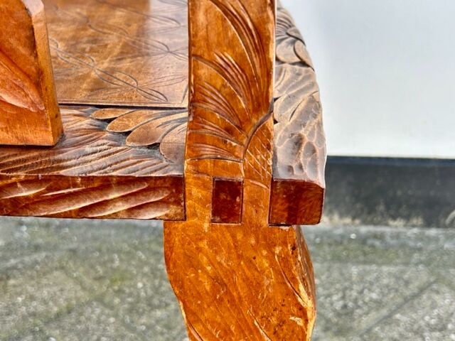 Hand stabbed teak armchair