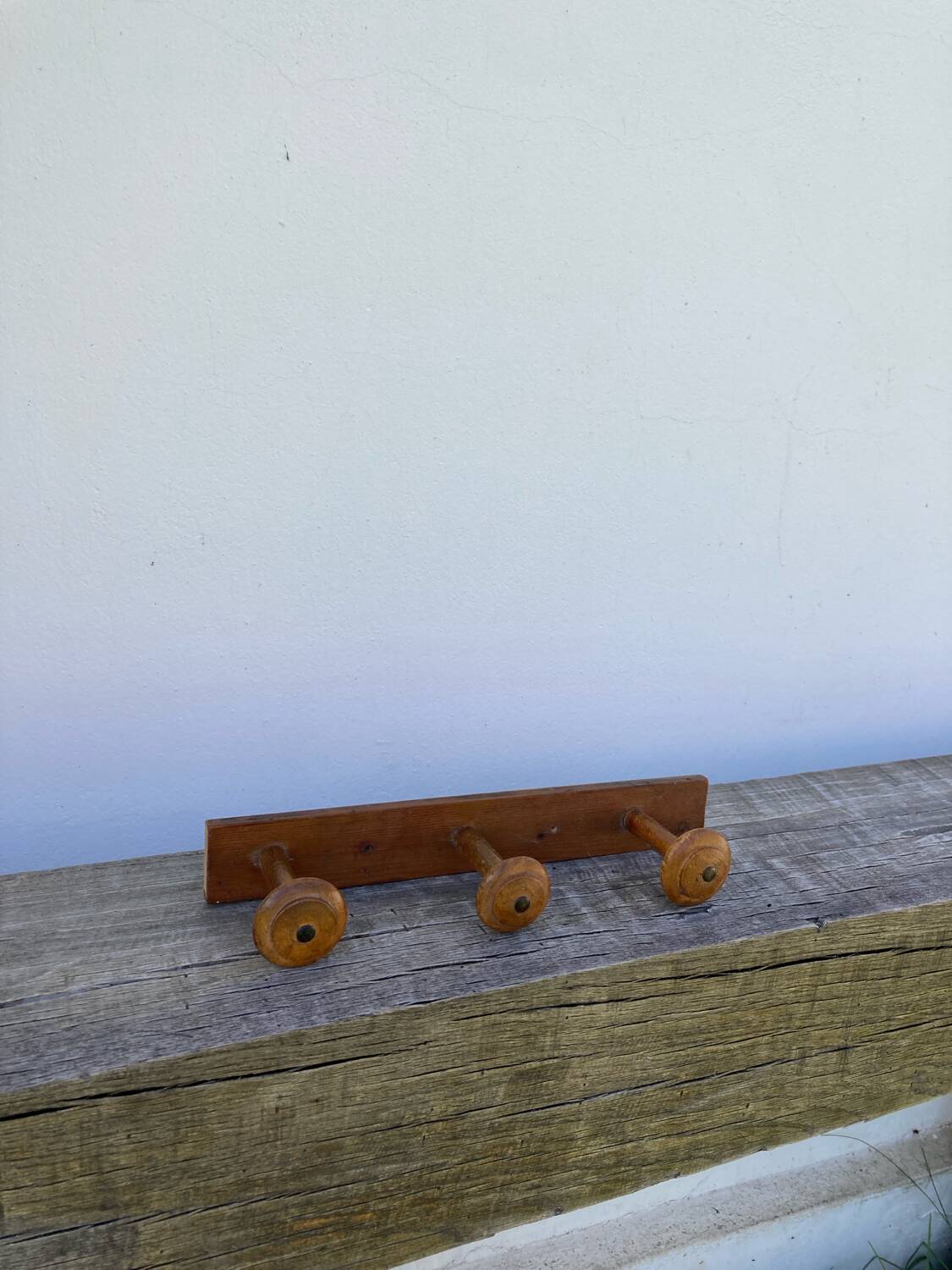 Old wooden wall coat rack