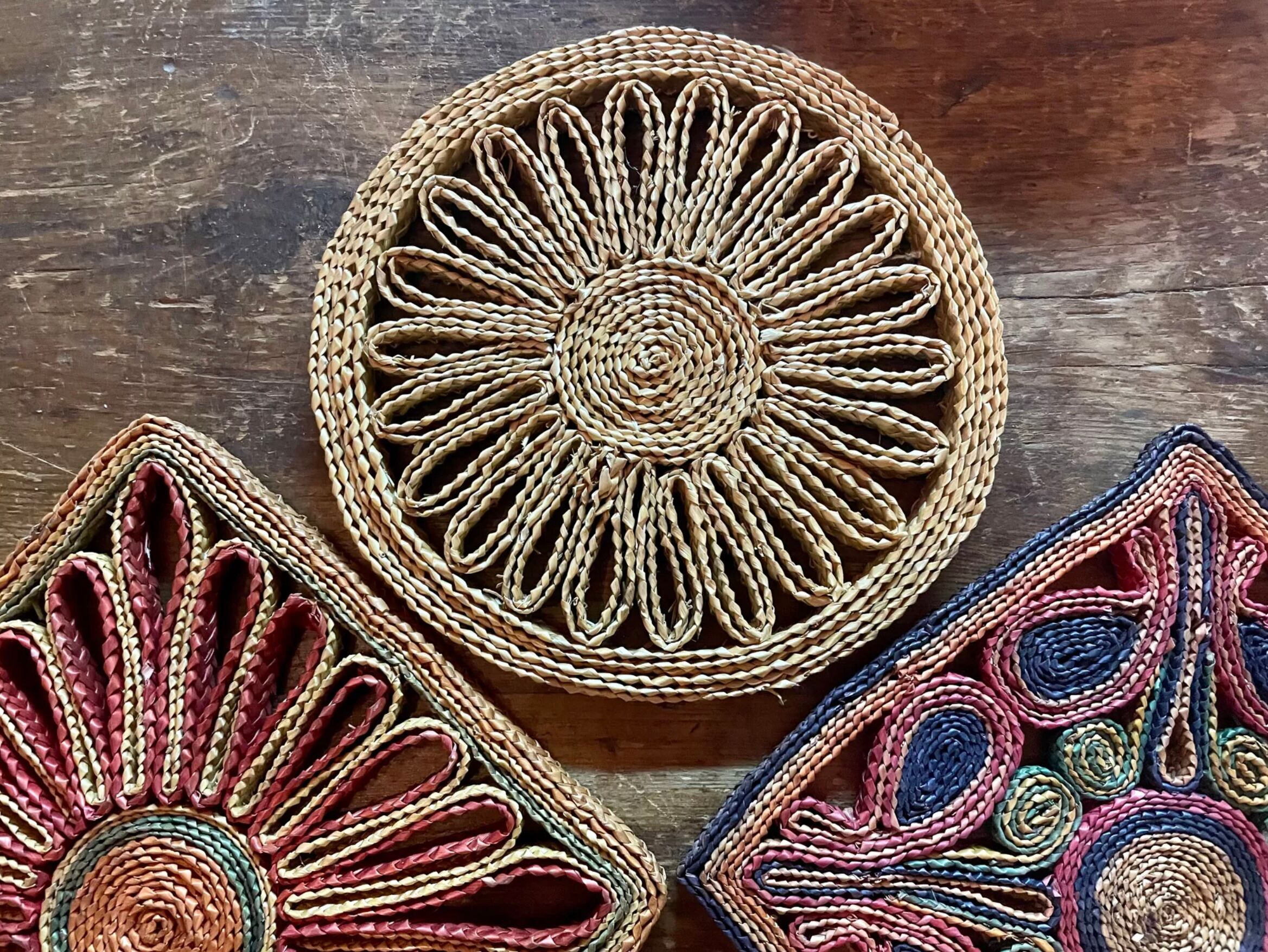 3 woven straw trivets