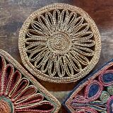3 woven straw trivets