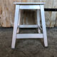 Vintage white wood milking stool