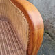 Fauteuil esprit colonial, bois et rotin, accoudoirs