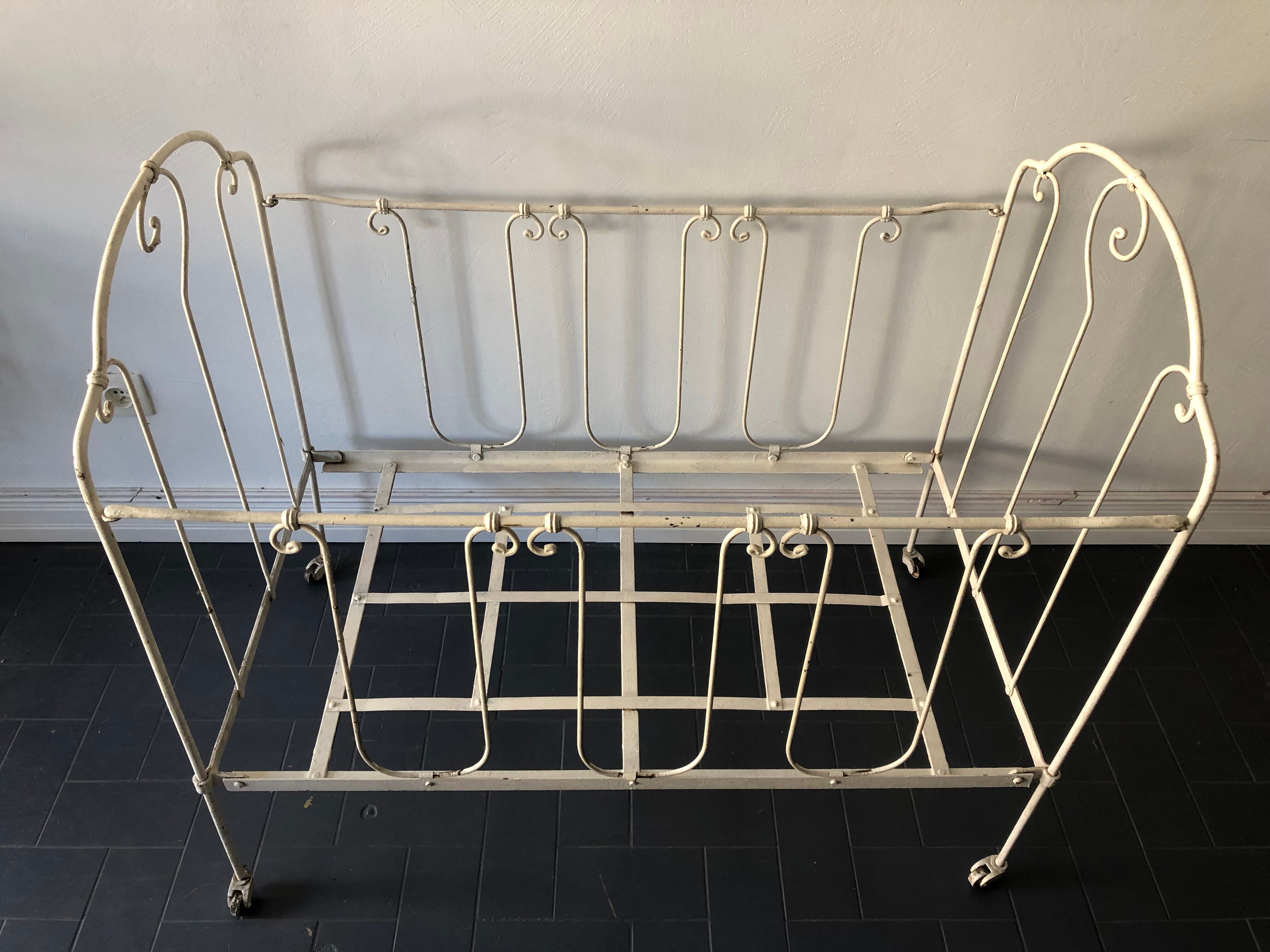 Old white wrought iron folding bed / seat