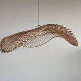 Rattan suspension or lighting fixture in the shape of an undulating circular tray with lattices