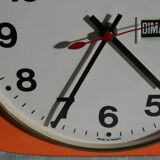 Vintage wall clock in orange formica