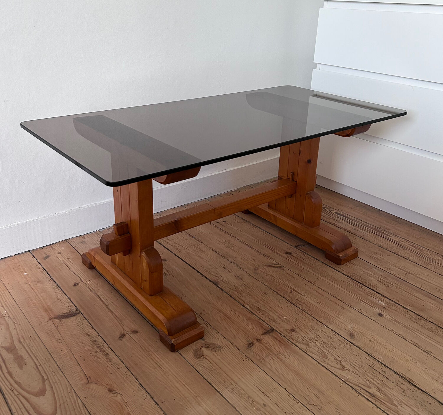 Pine coffee table with smoked glass top.