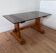 Pine coffee table with smoked glass top.