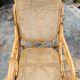 Rocking-chair vintage en rotin canné