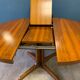 Expandable round table with butterfly extension